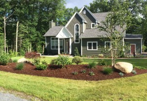 A planted berm for a newly constructed home