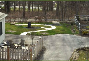 The sculpture garden path with a sitting rock